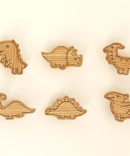 Dinosaur-shaped furniture knobs for nursery.