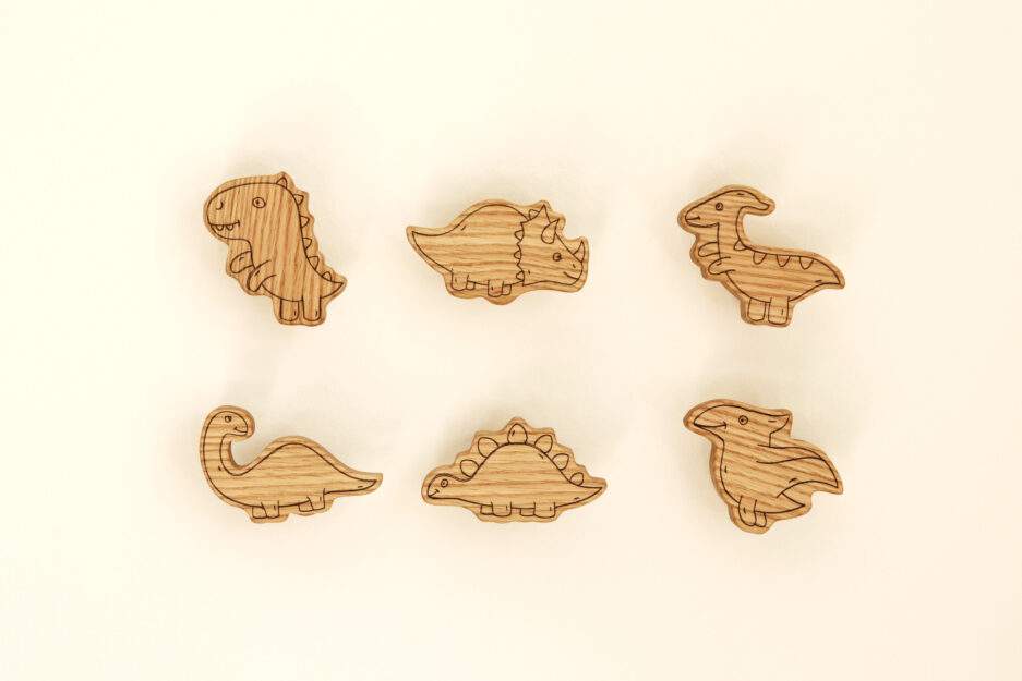 Dinosaur-shaped furniture knobs for nursery.