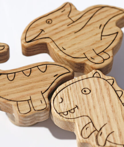 Dinosaur-shaped furniture knobs for nursery.