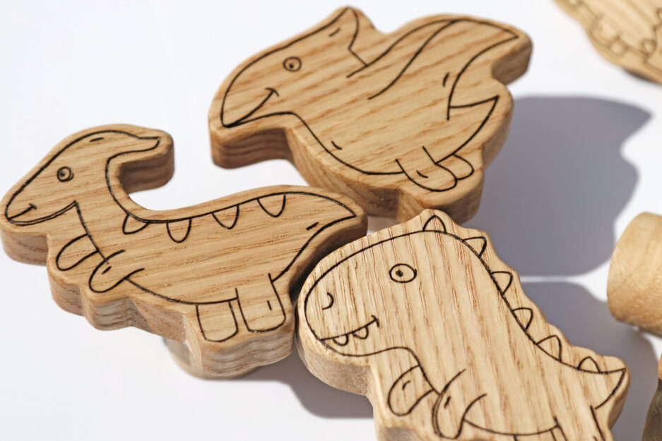 Dinosaur-shaped furniture knobs for nursery.