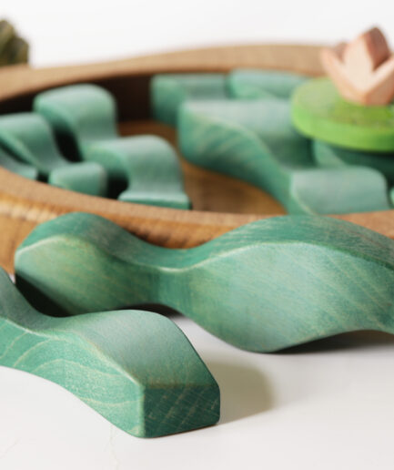 Educational wooden toy for kids – puzzle-like pond scene with smooth, colorful pieces.