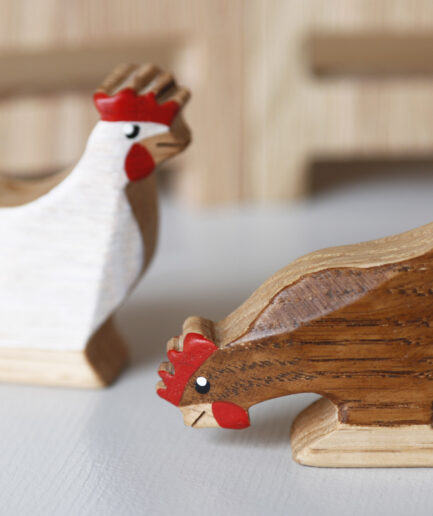 Wooden hen and rooster figurines made from natural wood